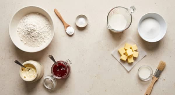 Self-raising flour, cold cubed butter, caster sugar, milk and baking powder for British scones