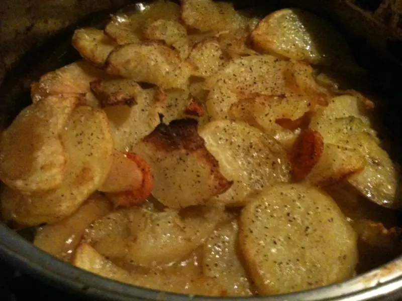 Overlap the potato topping - Step 4 for Traditional Lancashire Hotpot with Lamb and Potatoes