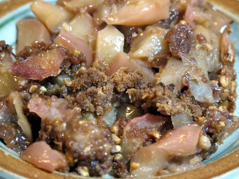 Scatter topping and bake until bubbling - Step 5 for Apple and Blackberry Crumble with Oat Topping